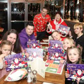 The Jenkins family tuck into a meal at Prezzo Corby thanks to Jeanette Walsh (Mother Christmas) and Simon Brunskill (manager)