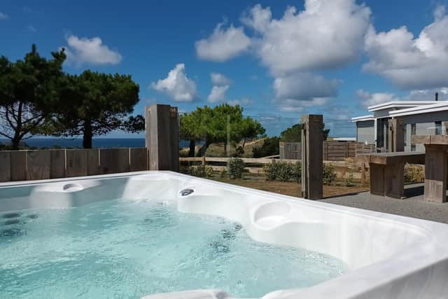 Soak up the sea views and the bubbles in a hot tub at Gull Rocks Beach