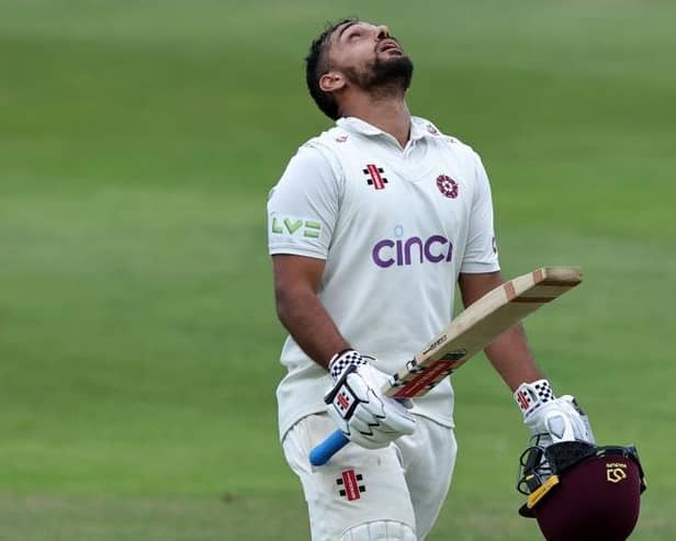 Saif Zaib shows his relief after completing his century against Surrey at the County Ground