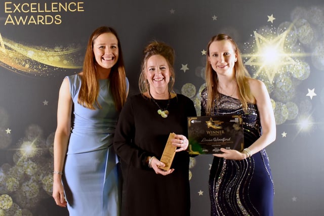 Louise Woodford, Healthcare Assistant, (centre) receiving the Patient Experience Award.
