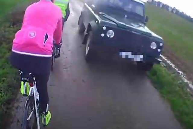 Land Rover driver caught on camera fined £1,000 after cyclist injured ...