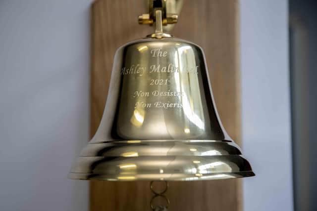 The bell's Latin phrase translates to, 'never give up, never surrender'