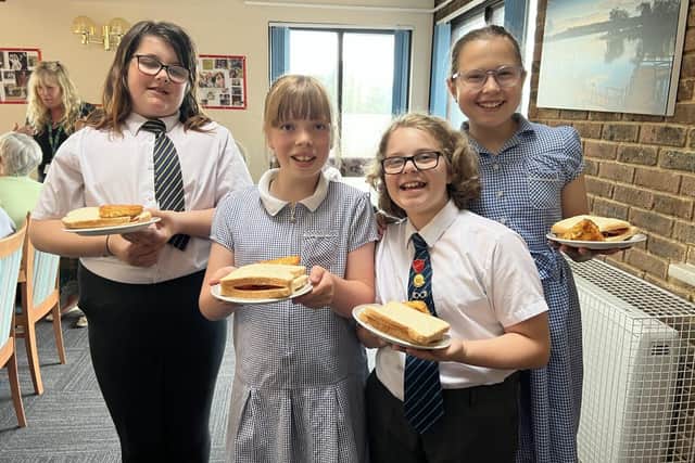 School children ready to serve bacon sandwiches