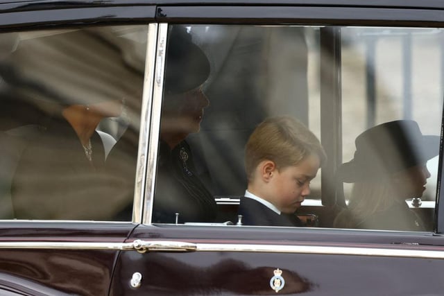 Camilla, Queen Consort, Catherine, Princess of Wales, Prince George and Princess Charlotte travel down The Mall