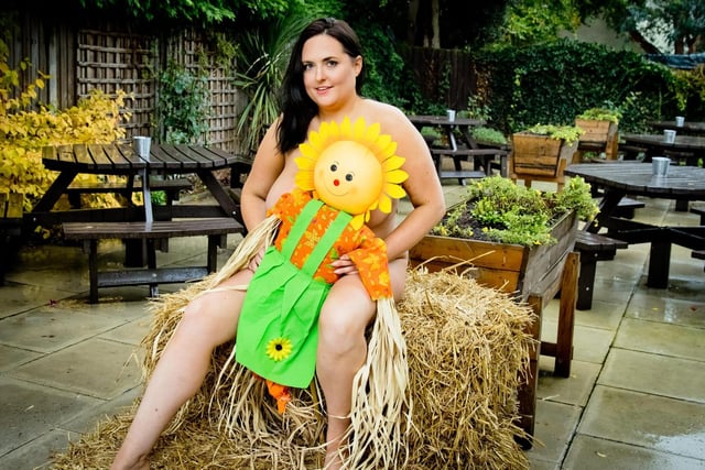 Kerry Prosser, 34, The Royal Oak manager, is featured on the calendar page for July, themed after The Crick Scarecrow Festival.