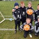 Young Brixworth FC players celebrate fund support