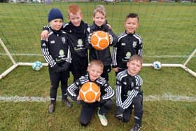 Young Brixworth FC players celebrate fund support