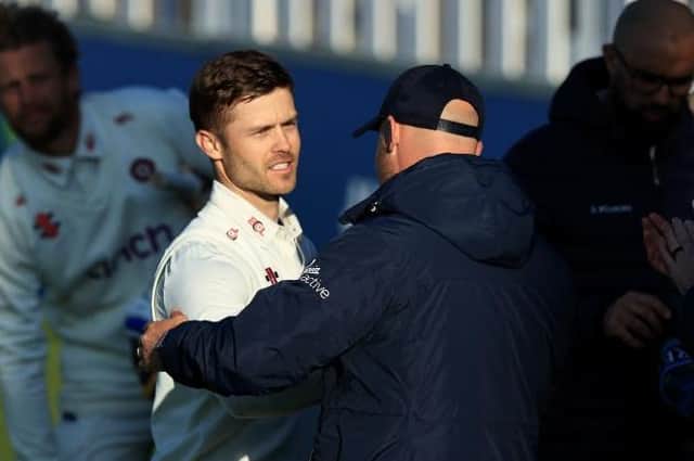 Lewis McManus is congratulated by head coach John Sadler after helping Northants to their draw against Yorkshire last weekend