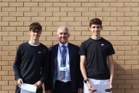 Mr Frazer pictured with Harry Railton (left) and Arthur Tilt (right). Both achieved top results.