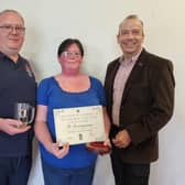 Linda and Darren, who have only owned The Countryman at Staverton for around three months, with Chris Heaton-Harris (right) after being named 'village pub of the year'