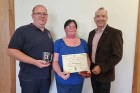 Linda and Darren, who have only owned The Countryman at Staverton for around three months, with Chris Heaton-Harris (right) after being named 'village pub of the year'