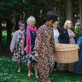 Sheron pictured on May 23 at Bannatyne Hotel Hastings carrying a wicker coffin with other celebrants, Kate Tym, Kate Dyer, Sarah Burnside, and Patsy Pearce.