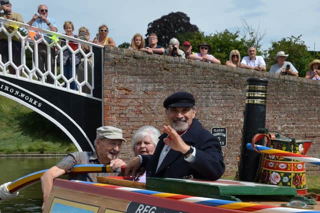 David Suchet on the Raymond for the opening of the 2018 Braunston Historic Rally. 2018 marked the 60th anniversary of launch of Raymond, built in Barlows Yard at what is today Braunston Marina. With him was Aubrey Berriman, shipwright for the Raymond, and former working boatwoman Alice Lapworth.