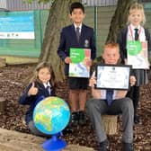 Falconer’s Hill Academy pupils pictured holding the Silver Primary Geography Quality Mark (PGQM) award.
