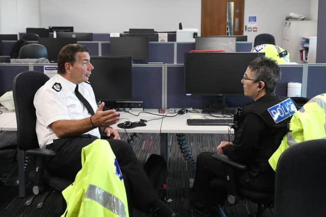 Chief Constable of Northamptonshire Nick Adderley talks with colleagues at the Kettering and Corby HQ