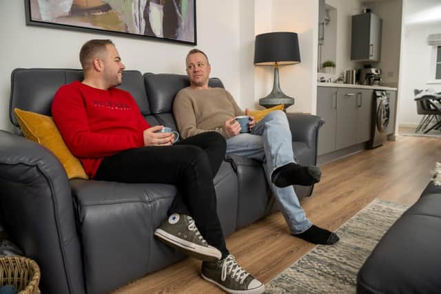 Connor and Adam Perry in the living room of their new Bellway home in Daventry