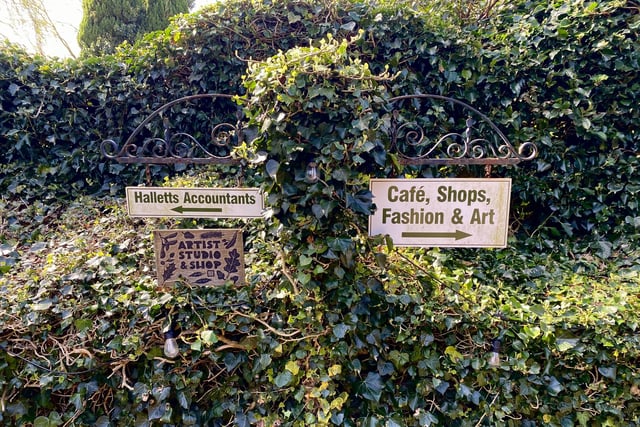 Signs next to The Hayrack Gallery pictured.
