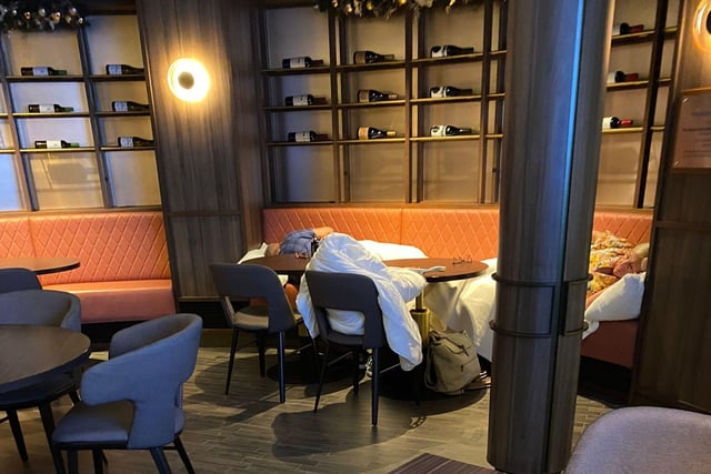 Passengers pictured sleeping in P&O Cruises' Glass House Restaurant after they were left stranded without access to other facilities.