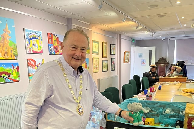 Mayor of Daventry, Councillor Ted Nicholl, pictured with Daventry Caring Kindergartens mascot 'Trunkie' and artwork projects.
