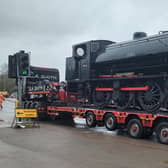 Northampton & Lamport Railway's latest arrival, a Hunslet Austerity steam loco, headed to its new home by road around Northampton