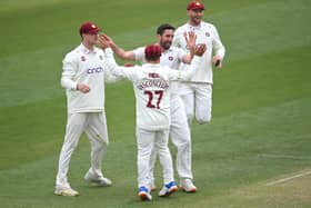 Ben Sanderson celebrates taking the wicket of Paul Walter