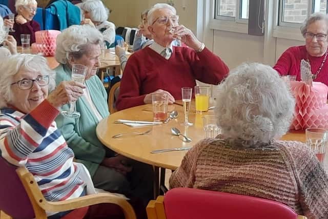 Affinity friends pictured celebrating a new location.