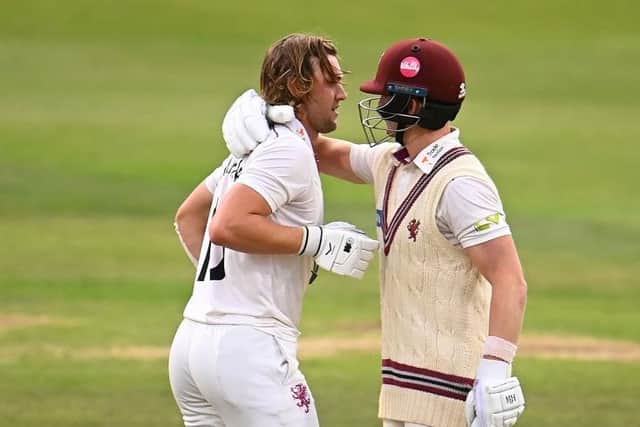 Somerset's Tom Lammonby (left) celebrates his century with fellow ton-up batter Tom Abell