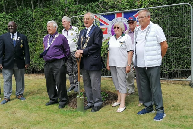 Daventry Mayor Malcolm Ogle plants a tree to mark the Queen's Jubilee with representatives of the club.