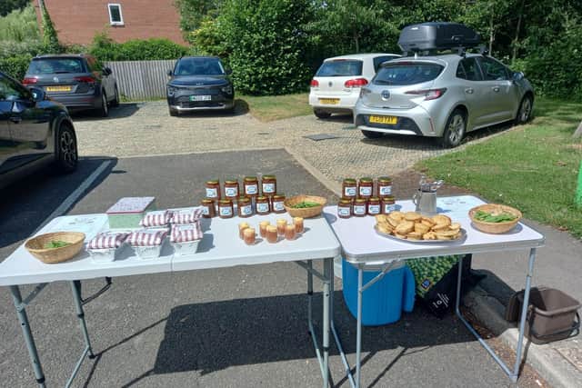 Barby Primary School’s Gardening Club selling rhubarb and gooseberry crumbles, pies, and jam for the fundraiser.