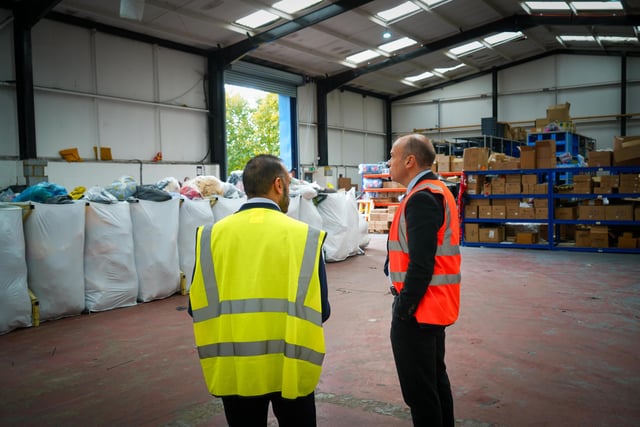 Daventry MP and Secretary of State for Northern Ireland, Chris Heaton-Harris, pictured at The Air Ambulance Service's (TAAS) warehouse with the charity’s reuse team.