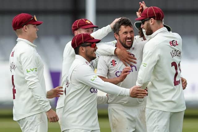 Simon Kerrigan celebrates claiming his first wicket of the season