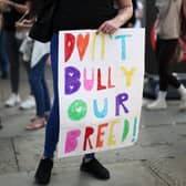 Supporters of the XL Bully dog breed hold placards during a protest against the UK Government's plans for the breed, in central London.
