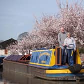 The couple on their narrowboat.