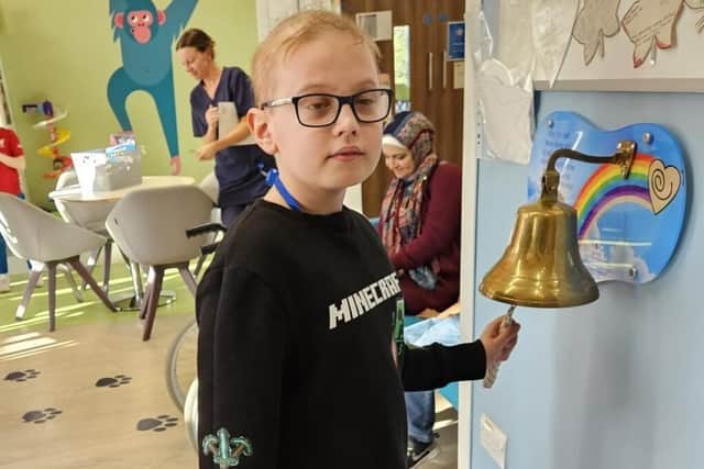 Levi rings the bell in hospital for the end of his treatment