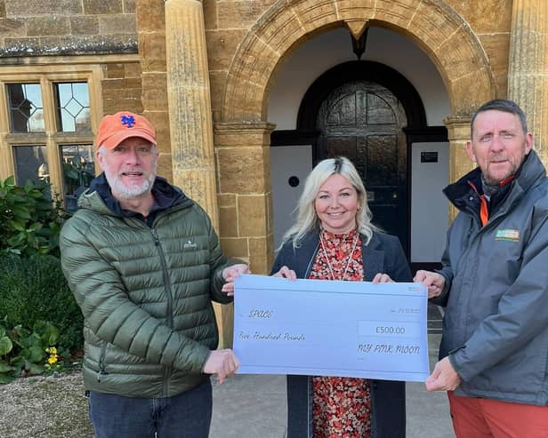 Hayley Brown pictured handing over the cheque to Keith Bunnett and Pete Spink, two Space to Talk founders and directors, on Saturday at Delapre Abbey.