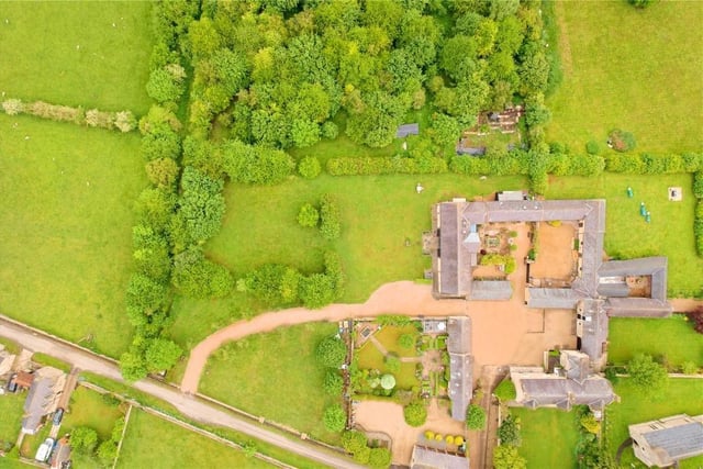 This barn conversion home comes with annexes and a lot of land.