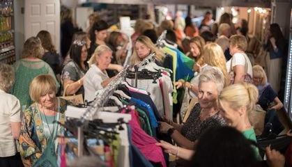 Guests browse some of the clothes on offer.