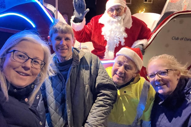 Santa pictured with Leaona Last, night leader and rotarian, Simon Shepherd, driver, Ian Robinson, the rotary treasurer and collector, and Sue Hobson, a collector and rotarian.