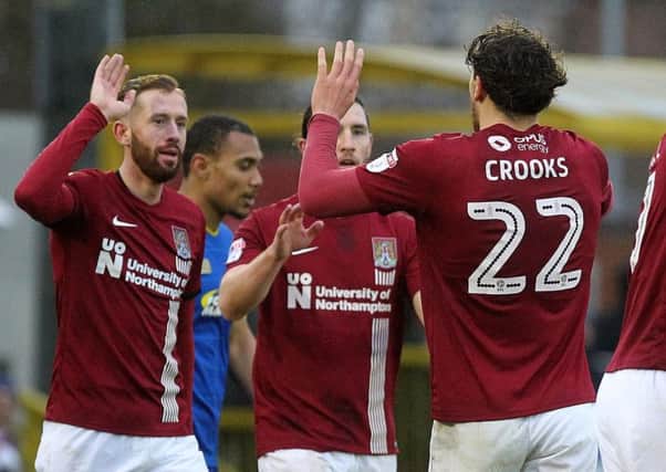 Kevin van Veen (left) was injured on his full Cobblers debut at Scunthorpe