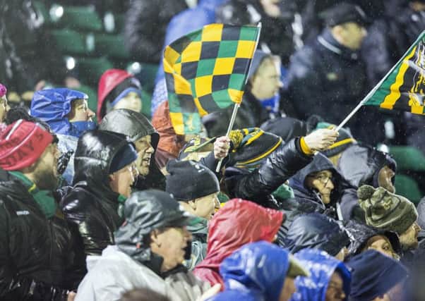 SINGING IN THE RAIN - Saints fans at The Rec on Friday (Picture: Kirsty Edmonds)