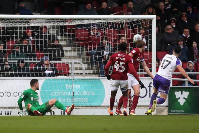 INSULT TO INJURY: Richard O'Donnell watches on, helpless, as Richie Towell's shot finds the corner of the net to put Rotherham 3-0 up at Sixfields. Pictures: Sharon Lucey