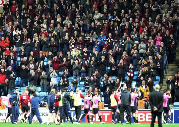BETTER TOGETHER - the Cobblers supporters and players celebrate the FA Cup win at Coventry City in November, 2015