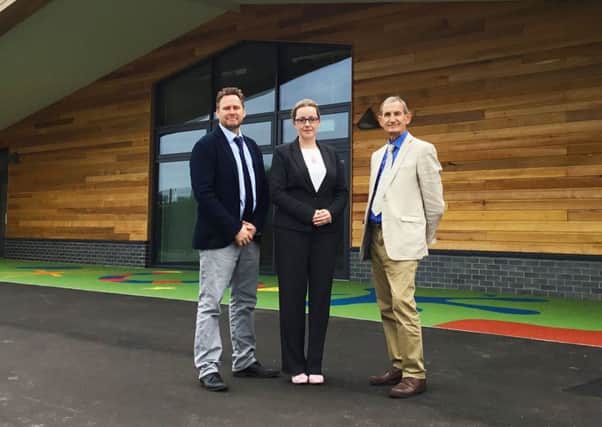 Daventry District Council project manager Rob Saunders, headteacher Katie Towers and DDCs economic, regeneration and employment portfolio holder, Councillor David James, at the new school.
