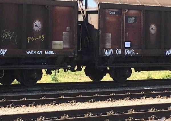 The sides of trains were graffitied