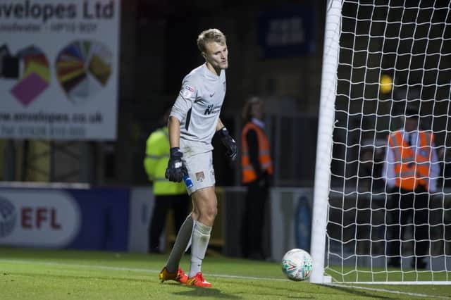 Lewis Ward couldn't keep out any of Wycombe's eight penalties despite getting close on several occasions. Picture: Kirsty Edmonds