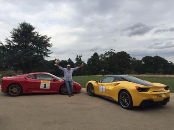 Dave poses next to the red F430 that helped him claim his second title and with the yellow twin turbo F488 which he hopes will deliver his third championship win