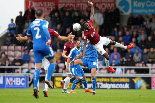 Leon Barnett acrobatically wins a header against Notts County on Saturday. Picture: Sharon Lucey