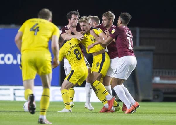 John-Joe O'Toole in the thick of the action at Oxford United on Tuesday night (Pictures: Kirsty Edmonds)