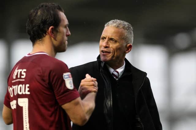 Cobblers boss Keith Curle and goalscorer John-Joe O'Toole. Pictures: Sharon Lucey