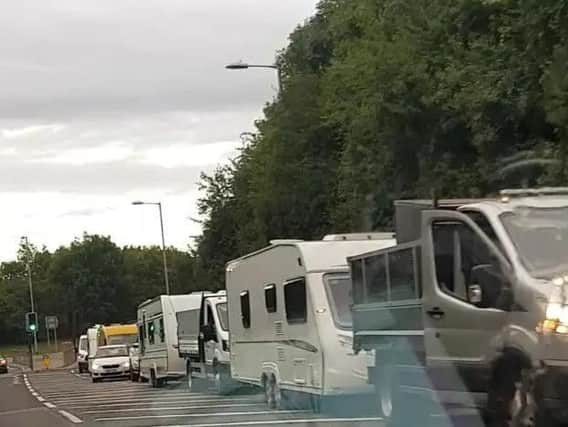 Travellers have camped several times in Daventry this year - here they are pictured queueing to get into the country park in mid-September